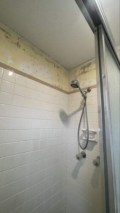Older tile shower before remodel